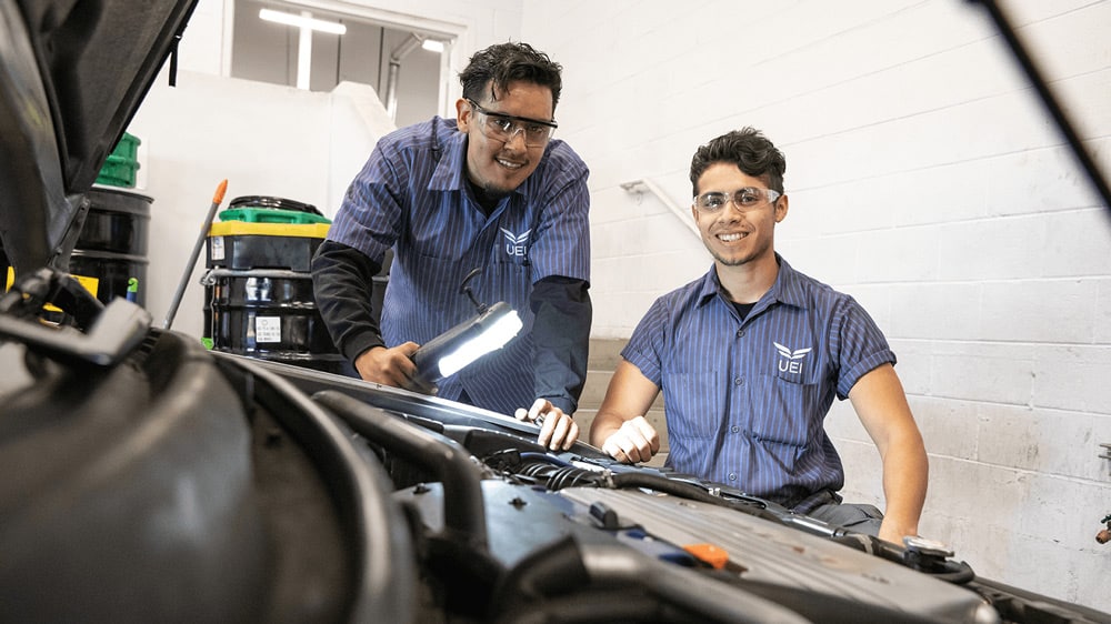 Automotive-Technician-Trade-School-Program-UEI-College auto-mechanics-working-on-car