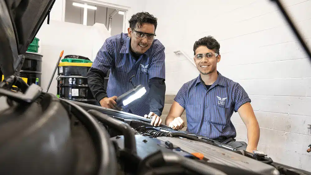 Automotive-Technician-Trade-School-Program-UEI-College auto-mechanics-working-on-car