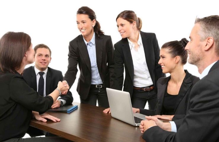 Essential Skills for Any Profession - UEI College professional women and men sitting at table