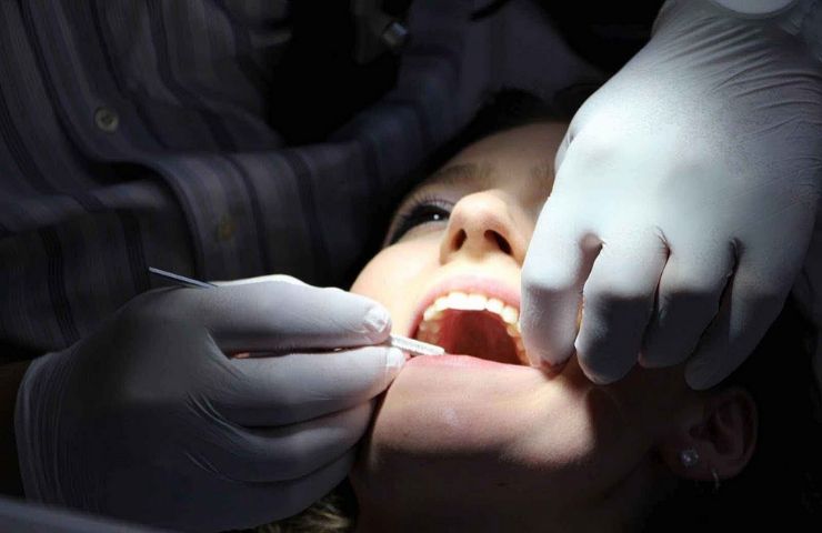 dental assistant working on patient