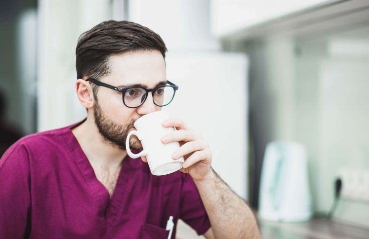 UEI College student drinking coffee