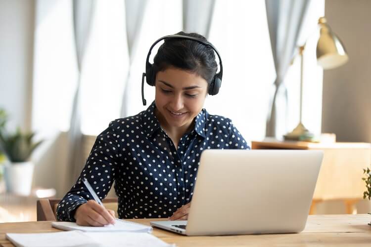 5 Tips for Distance Learning Success - UEI College Female student working on laptop