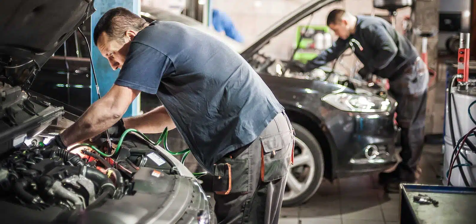automotive-technician-working-on-car