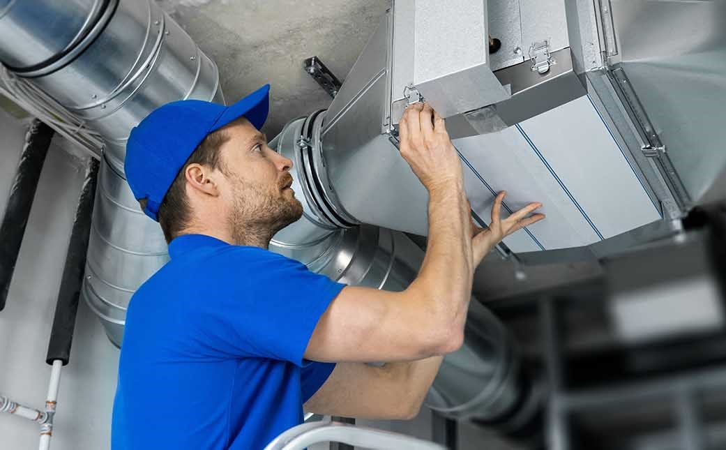 hvac-tech-installing-hvac-equipment