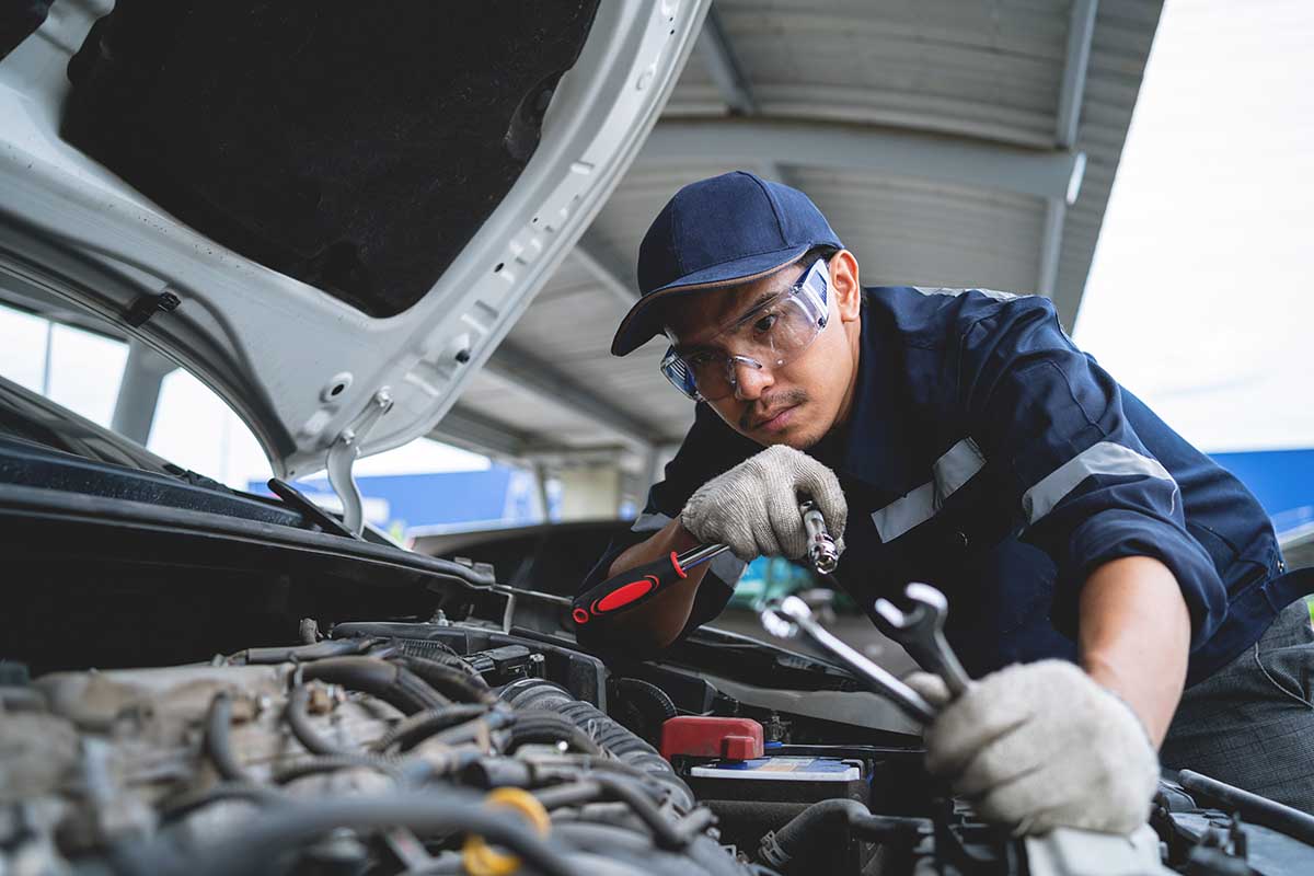 automotive-technician-working-on-car