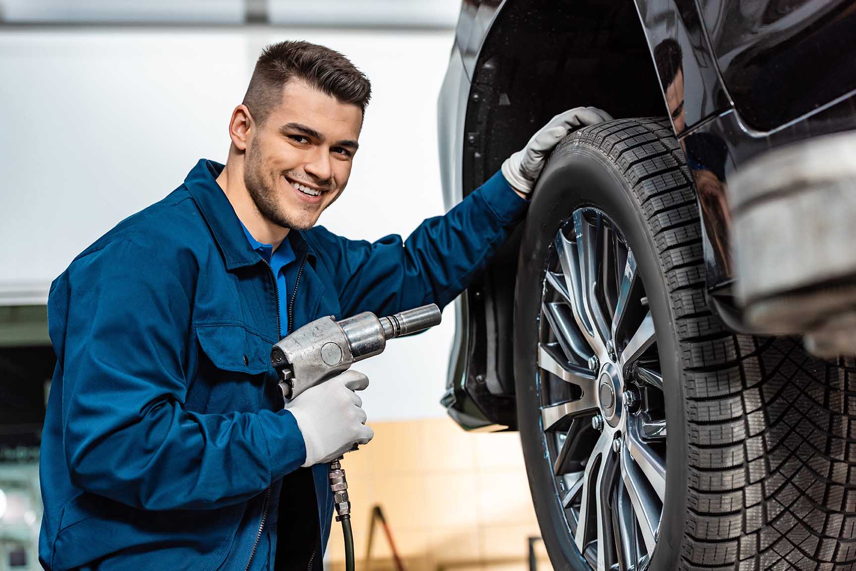 automotive-mechanic-working-on-car