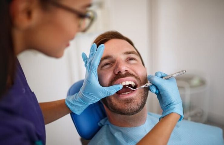 dental assistant working on patient