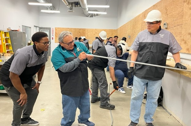 Gregg Falcon rolled up his sleeves and joined the Electrician Technician students in their weekend classes to learn more about the program. 